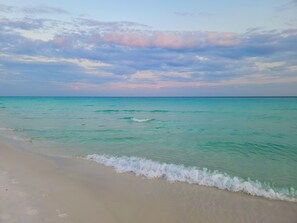A beach with clear turquoise water and a sandy shore. - Sun Puppy Point, 1st Flr w/ Cart, 2 Kings, 2bd/2ba, early bird discount, pool! (Miramar Beach)