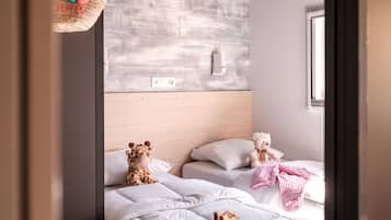 Relax in a cozy space with a large bed, headboard, and natural light.