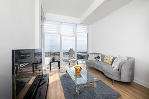 Enjoy a panoramic city view from the comfort of this stylish living space.