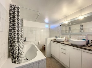 Bathtub, hair dryer, towels