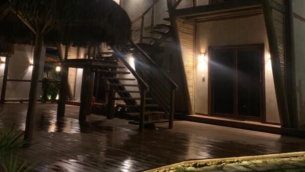 A multi-story building with a staircase leading to an upper level. - VILLA CRIS (Fernando de Noronha)