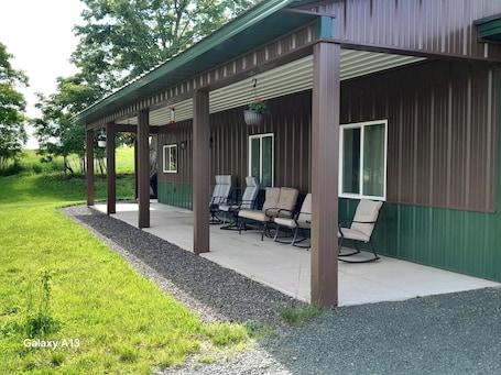 Terrace/patio. Brand-New House on 130 Acre Farm