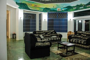 Panoramic Villa, 3 Bedrooms, Sea View, Mountainside | Living area | 40-inch Smart TV with cable channels, TV, Netflix - Sunshine Lodge- Your Home Away From Home (Montego Bay)