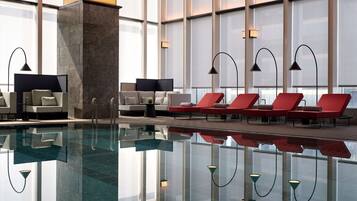 Indoor pool, open 6:30 AM to 10:00 PM, pool loungers, lifeguards on site