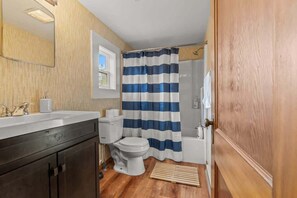 Bathtub, hair dryer, shampoo