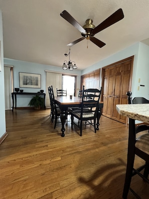 Enjoy meals in this classic dining area with a large table and six comfortable chairs.