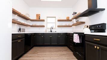 Mini-fridge, microwave, coffee/tea maker, cookware/dishes/utensils
