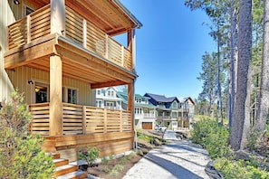A wooden cabin with a balcony, surrounded by a forest. - *NEW* Latitude Adjustment: Oceanview, Hot Tub, Dog Friendly! (Pacific Beach)