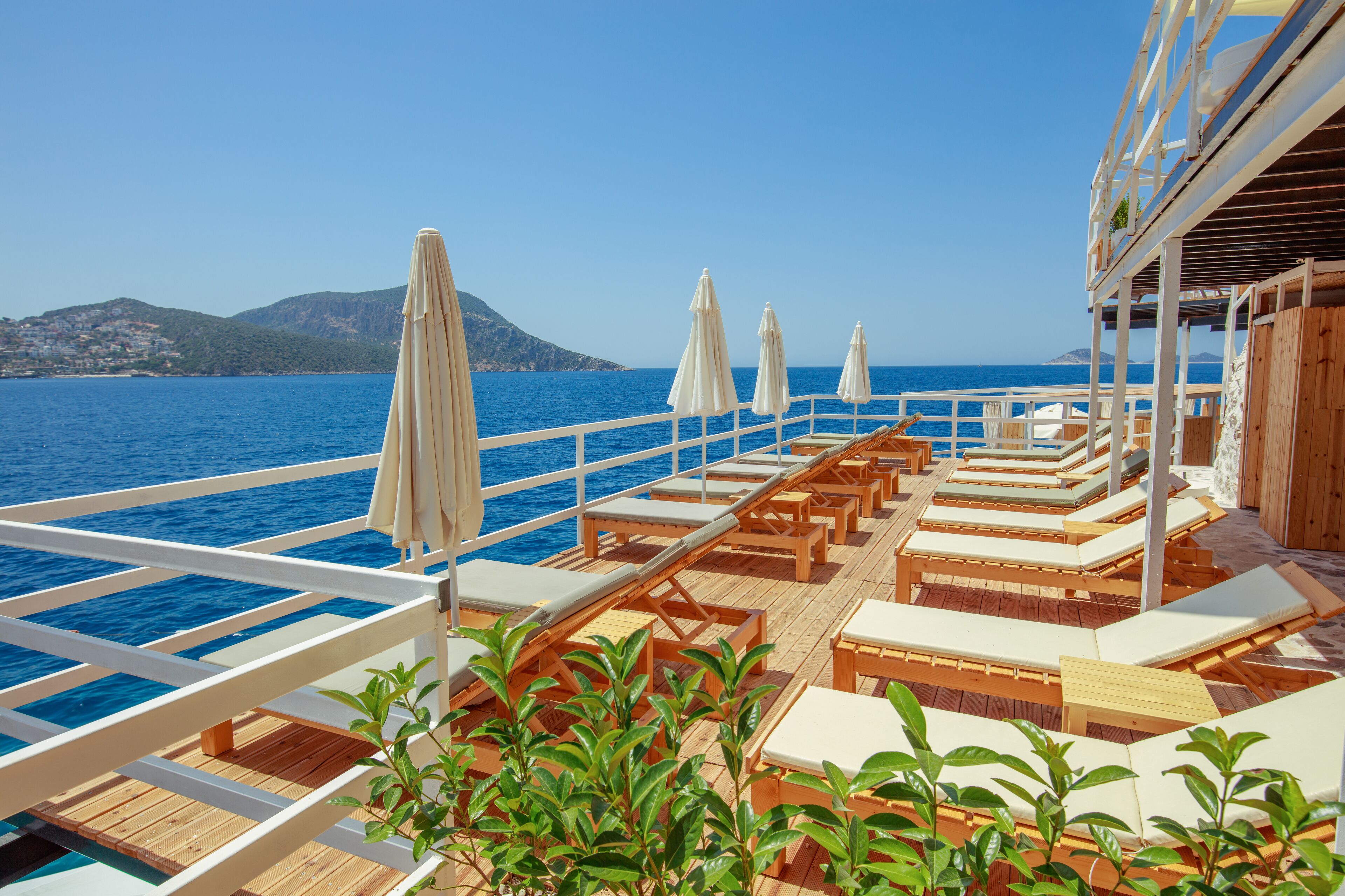 Private beach, black sand, sun loungers, beach umbrellas