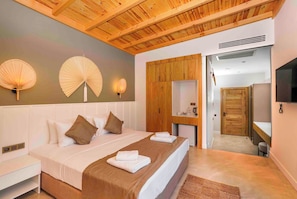 A bedroom with a wooden ceiling, a bed with white bedding, two wall-mounted fans, and a wooden wardrobe.