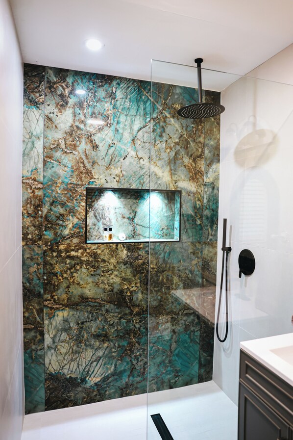 Shower, hair dryer, towels, soap