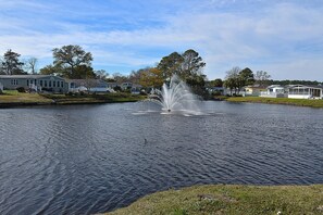Surrounded by a serene lake and lush greenery, this peaceful neighborhood offers a tranquil escape.