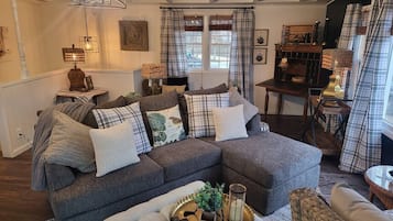 Smart TV, fireplace, books, offices