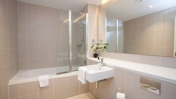 Bathtub, hair dryer, towels