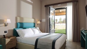 A hotel room with a bed, a nightstand, a lamp, a dresser, and a view of the outdoors through a glass door. - Villa Antica Dimora intera struttura - Homelike Villas (San Donato)