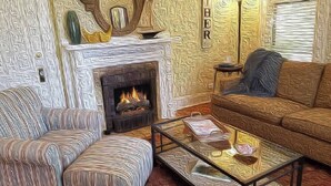 A living room with a fireplace, striped armchairs, a sofa, and a coffee table.