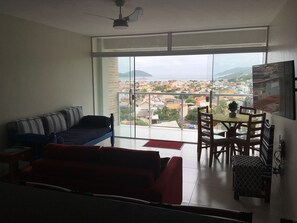 Smart TV - Charming apartment with AC and ocean view. (Arraial do Cabo)