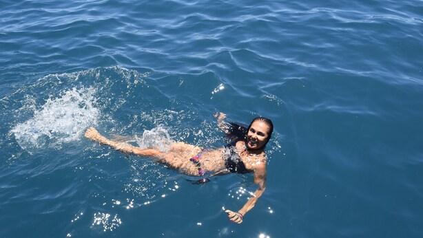 A person floating on water.