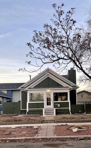 A single-story house with a gabled roof, a front porch, and a small front yard. - NEW! Heart of Downtown: The Hill Oasis (Grand Junction)
