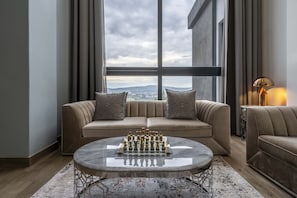 Royal Penthouse, Terrace, Hill View | Living area | 55-inch Smart TV with cable channels, TV, toys