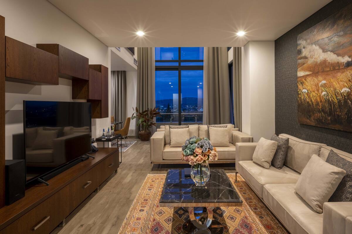 Presidential Penthouse, Sauna, Hill View | Living area | 55-inch Smart TV with cable channels, TV, toys