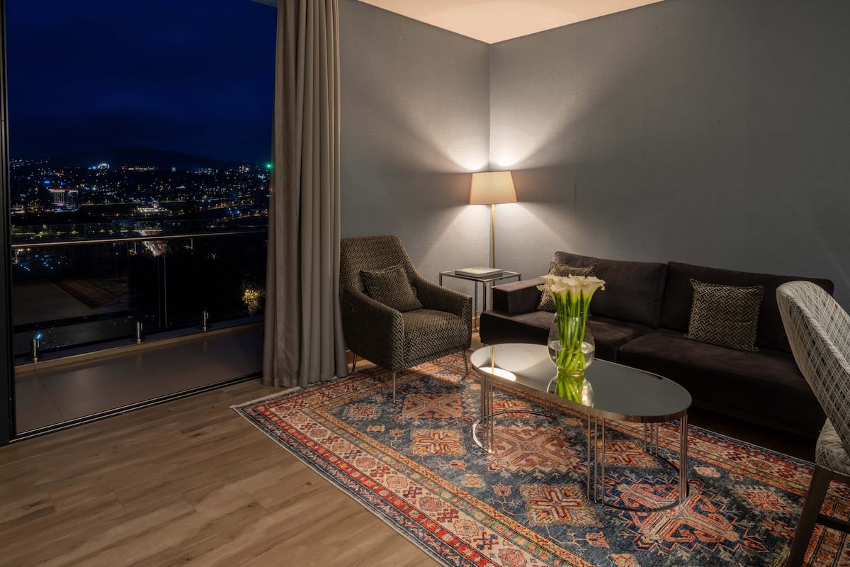 Superior Suite, Non Smoking, City View | Living area | 55-inch Smart TV with cable channels, TV, toys