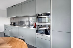 Fridge, microwave, oven, stovetop - Lovely Enge 2.5 Room w/ Storage & W/D, in Fifa Museum, by Blueground (Zurich)