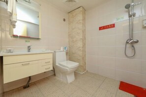 A bathroom with a toilet, sink, and shower. - Meinaya Hotel (Kunming)