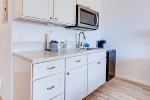 Fridge, microwave, coffee/tea maker, toaster