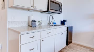 Fridge, microwave, coffee/tea maker, toaster