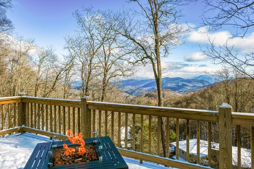 Elevated mountain-view cabin with private hot tub, 2 decks, firepit, & grill