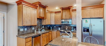 Dog-friendly sound-front cottage with fireplace, deck, lawn, beach access, & W/D