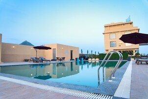 Outdoor pool, pool umbrellas, pool loungers