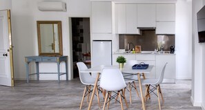 A modern kitchen with white cabinets, a built-in oven, and a coffee machine. - Palacete da Baixa, Studio Superior appartment (Faro)