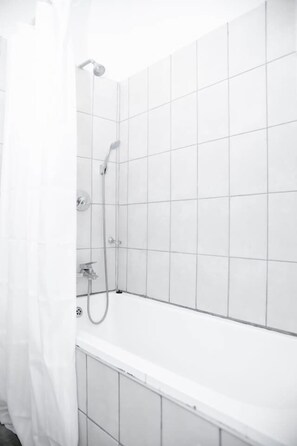 Bathtub, hair dryer, towels