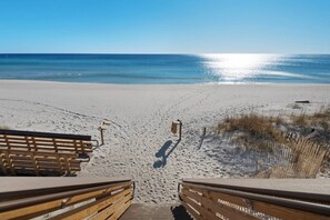 A wooden boardwalk leading to a sandy beach with a clear view of the ocean. - Near Beach | Community Pool | Bike to Shops & Restaurants | New Home | Home Office | Free Golf Cart (Santa Rosa Beach)