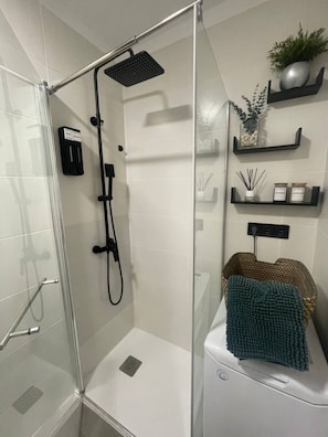 Shower, hair dryer, towels, soap