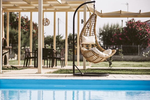 Seasonal outdoor pool, pool umbrellas, pool loungers