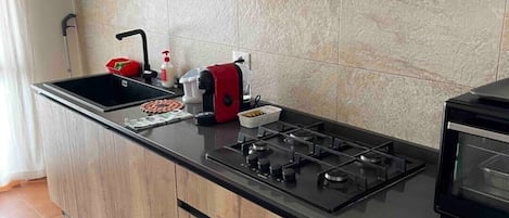 Fridge, microwave, stovetop, coffee/tea maker