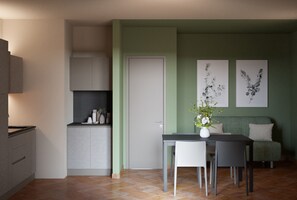 Comfort Condo, 3 Bedrooms, Garden View | Private kitchen | Oven, stovetop, freezer, dining table - Rocce Rosse Sardinia (Trinità d'Agultu e Vignola)