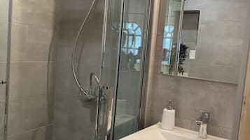 Shower, hair dryer, towels, soap
