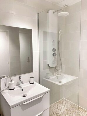 Shower, hair dryer, towels, soap