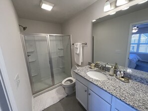 Shower, hair dryer, towels, soap