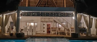 Private villa with swimming pool and tropical garden.