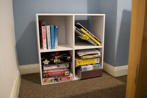 Enjoy a collection of board games and books in this cozy space.