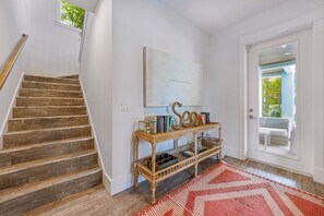 A staircase with wooden steps leading to a landing.