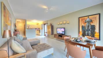 Family Apartment, 2 Bedrooms, Lakeside (Emotion Lake View) | Living area | 21-inch flat-screen TV with cable channels