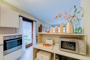 Family Apartment, 2 Bedrooms, Lakeside (Emotion Lake View) | Private kitchen | Fridge, microwave, oven, stovetop