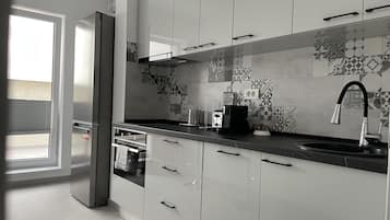 Panoramic Apartment | Private kitchen | Full-size fridge, microwave, oven, stovetop