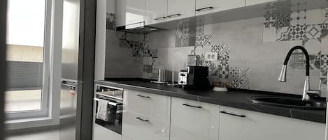 Panoramic Apartment | Private kitchen | Full-size fridge, microwave, oven, stovetop